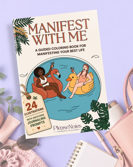 Manifest With Me workbook cover styled on a lavender background with a pink handbag, sunglasses, scrunchie, pen and notebook