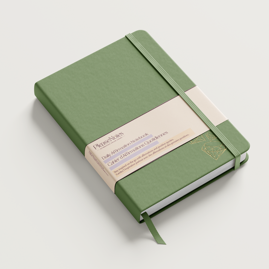 Green notebook with a strap on a light gray background